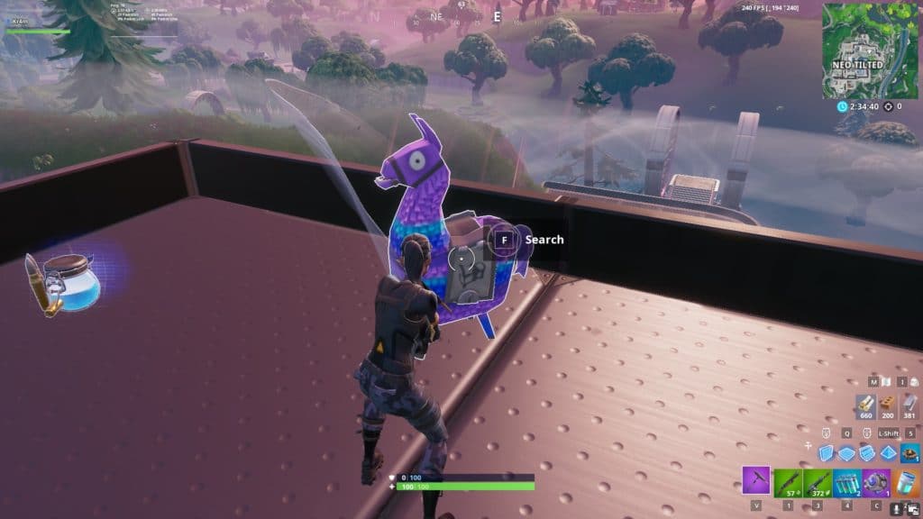 Breaking a llama in Fortnite by hitting it with a pickaxe