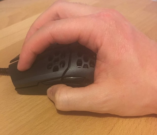 My hands gripping the MM710 with a claw grip